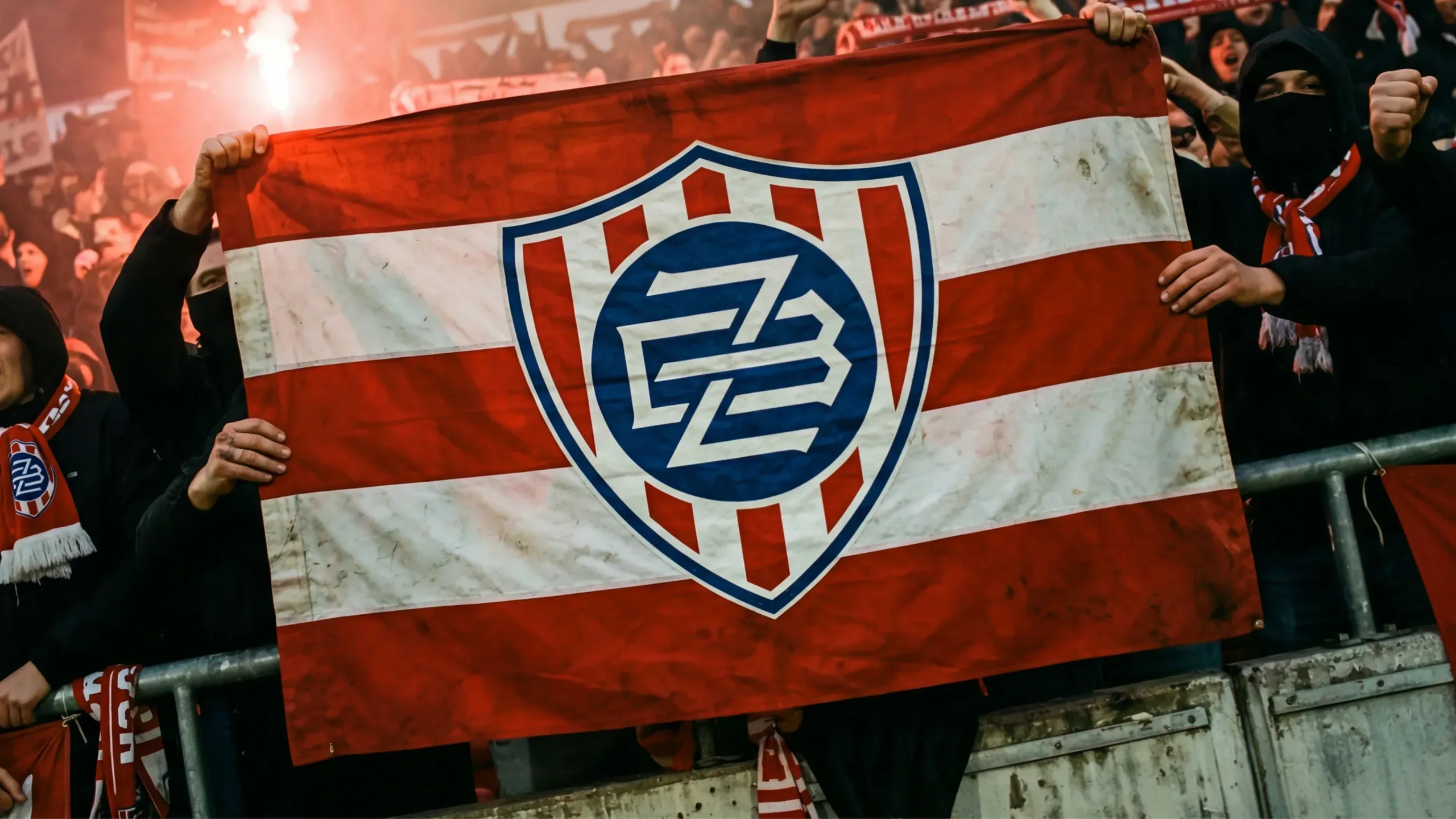 Fans holding a flag with the Zbrojovka crest