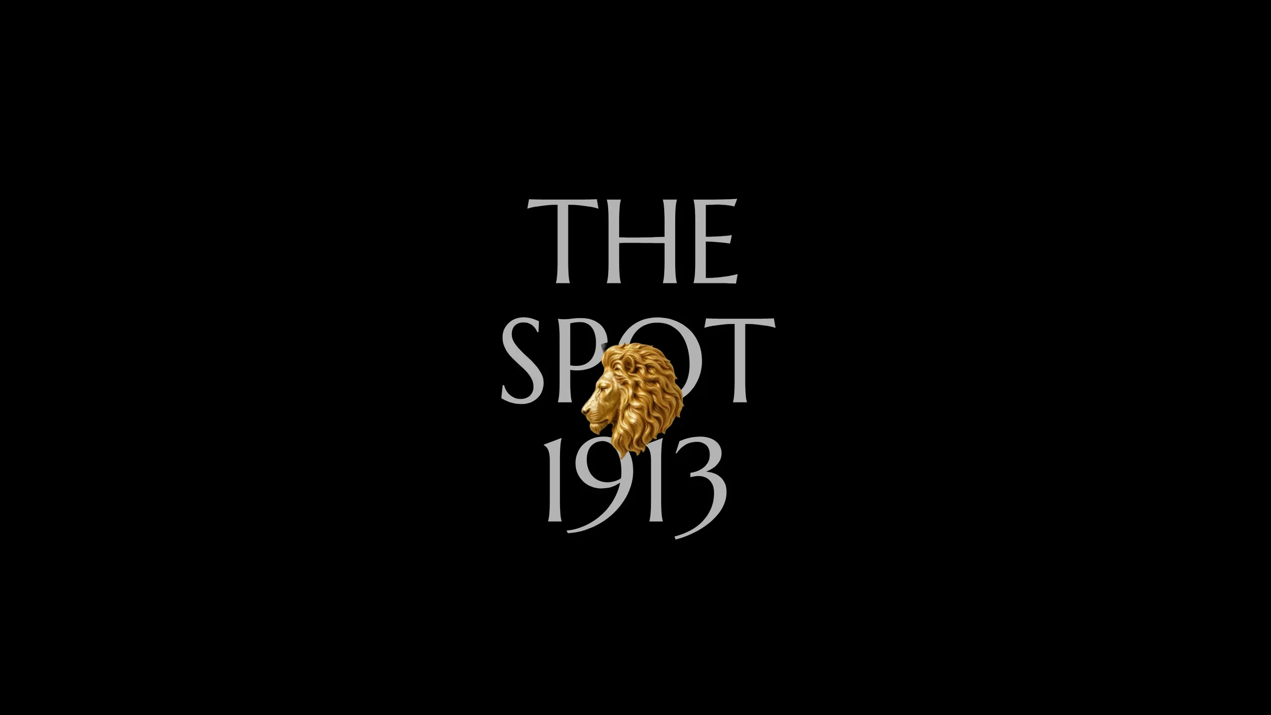 The Spot 1913 wordmark with a gold statue