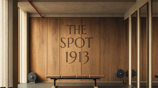Gym with The Spot 1913 lettering on a wooden wall
